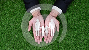 Background of paper family icon held in the hand. Gyre