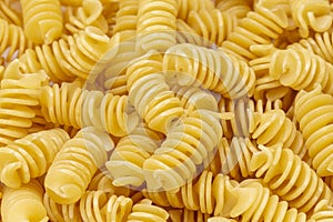 Background from Pasta. Fusilli spirale texture photo
