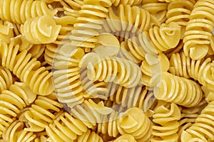 Background from Pasta. Fusilli spirale texture photo