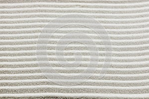 Background pattern of raked white sand