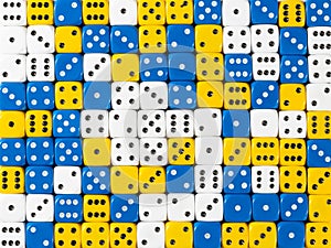 Background pattern of random ordered white, blue and yellow dices