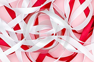 Background pattern. satin ribbons on pink background