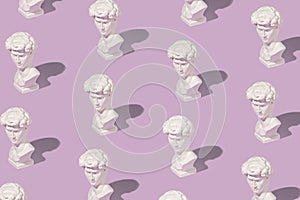 Background pattern of white Grecian or Roman busts photo