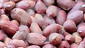 Background of peanut placer bright snacks; close-up photo