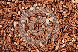 background of peeled walnuts close up top view