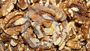 Background of peeled walnuts.Closeup of big shelled walnuts pile.