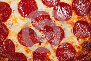 Background of pepperoni pizza with cheese