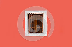 Background photo of Exterior wall, painted fresh with solid color of peach. The wall is clean, plain and a Vintage Wooden Window.