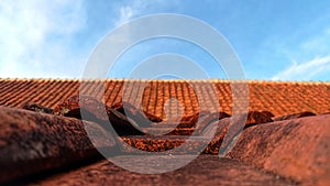 Background photo of a house whose roof is made of clay that is burned until it hardens.