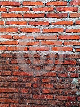 Background photo of old brick wall and new brick wall built on top of it, high resolution.