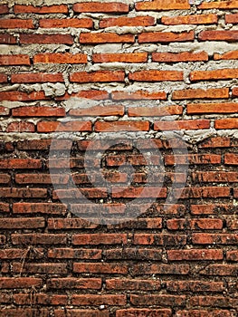 Background photo of old brick wall and new brick wall built on top of it, high resolution.