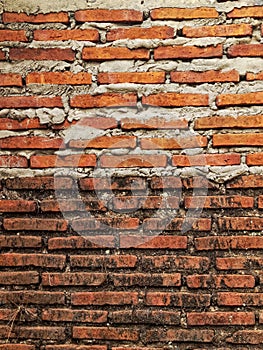 Background photo of old brick wall and new brick wall built on top of it, high resolution.