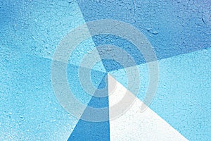 Background photo of a textured surface with a geometric pattern of blue shades.