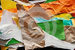 Background with Pieces of torn colored paper in abstract composition