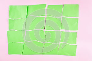 Background with pieces of torn green paper