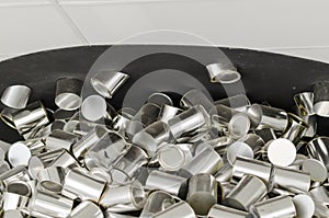 Background with a pile of aluminum cans, steel, tin ... photo