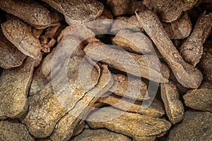 Background of pile of dog bone treats filling frame - selective focus