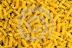 Background of A pile of pasta spiral fusilli