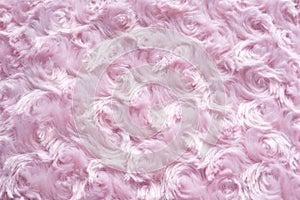 Background of pink faux fur with curls