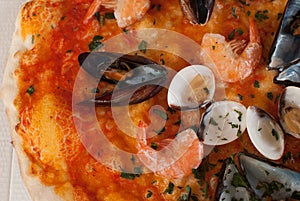 Background of pizza frutti di mare with mussels, clams and shrimps photo