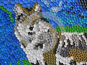 Background of plastic colorful bottle caps. Contamination with plastic waste. Environment and ecological balance. Art from junk.