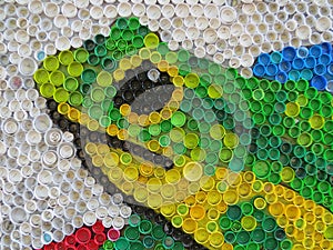 Background of plastic colorful bottle caps. Contamination with plastic waste. Environment and ecological balance. Art from junk.