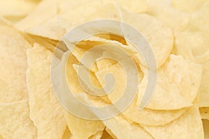 Background of potato chips. Close up.