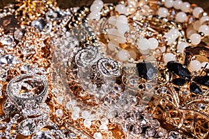 Background of precious golden and silver luxury jewelry.