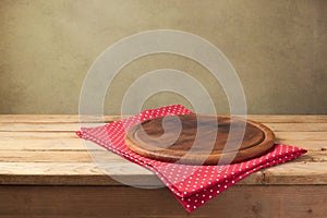 Background for product montage. Round wooden board with tablecloth.