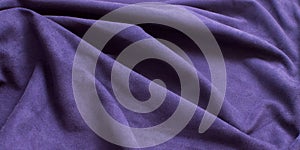 Background of purple suede, rumpled textured leather fabric