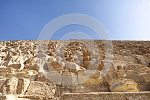 background of pyramid bricks. Slope of three big pyramid of Giza pyramid complex and sky behind