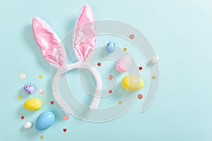 Background with rabbit ears and Easter eggs. The concept of finding eggs for Easter. Happy Easter celebration. Space for