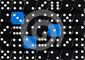 Background of random ordered black dices with three blue cubes