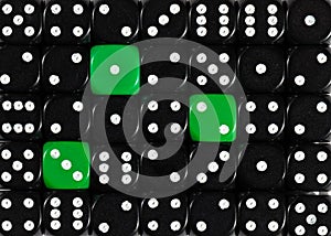 Background of random ordered black dices with three green cubes