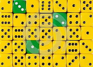 Background of random ordered yellow dices with three green cubes