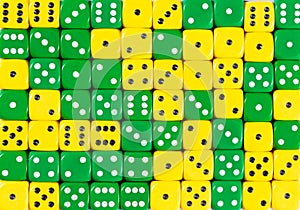 Background of 70 random ordered yellow and green dices