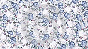 A background of randomly scattered Singapore Dollars in SGD 50 denominations. Singaporean currency. Paper money or banknotes of