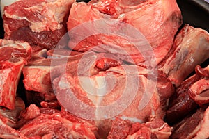 Background with raw meat with bone.Raw meat with beef bone. Beef bone selection for soup.selective focus