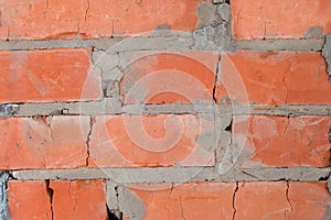 Background from red bricks close-up. Brick wall texture