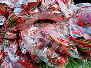 Background of Red Hot Chilies in Plastic Bags