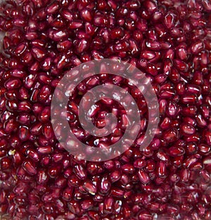 Background of red ripe pomegranate seeds. Raw organic fruits vegetables.