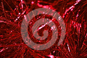 Background of red tinsel close-up.
