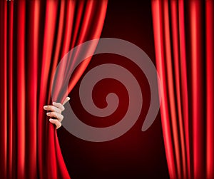 Background with red velvet curtain and hand.