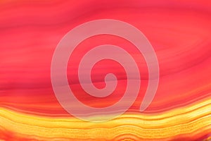 Background of red and yellow colored translucent agate stone