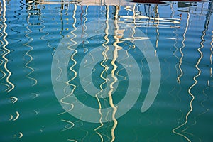 Background: reflection in a sea of yacht masts. photo