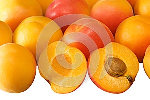 Background with ripe apricots on white