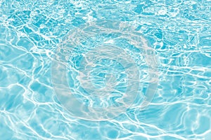 Background of rippled pattern of clean water in blue swimming po