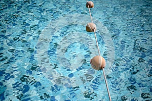 Background of rippled pattern of clean water in a blue swimming pool