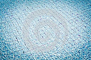 Background of rippled water in swimming pool