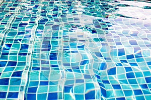 Background of rippled water in swimming pool